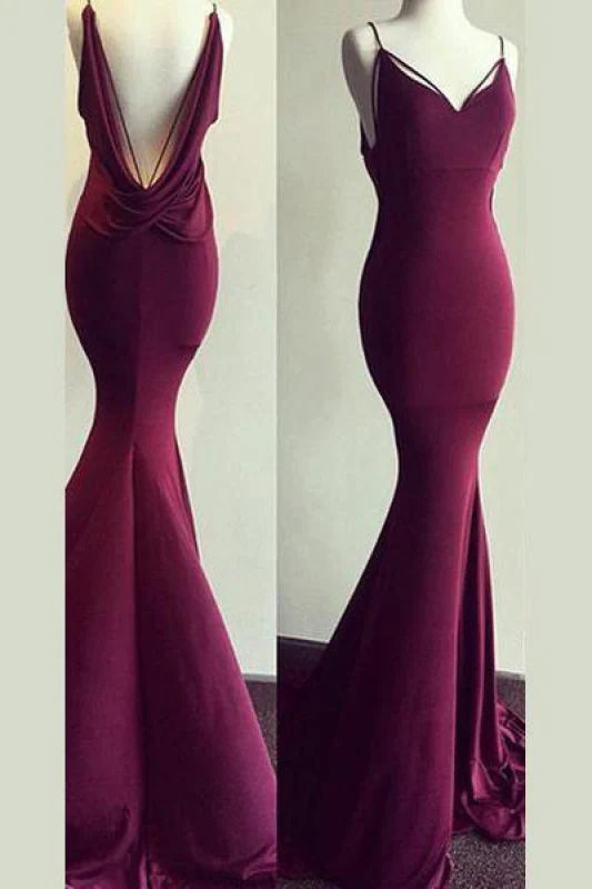 Elegant navy blue mermaid prom dress with V-neck, spaghetti straps, and backless design.