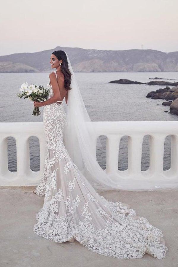 Side view of the elegant mermaid bridal gown with straps.