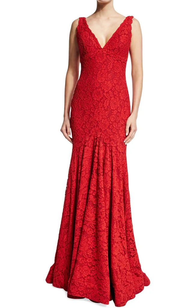 Model wearing an elegant mermaid V-neck lace evening gown with delicate straps.