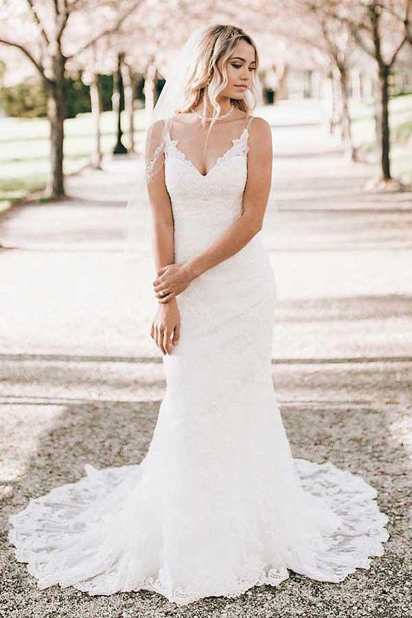 Elegant mermaid V-neck lace wedding dress with a sweep train.