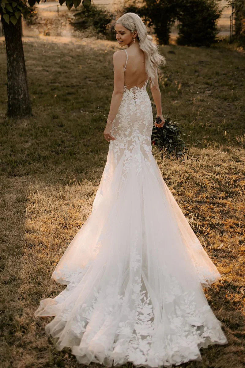 Back view of the mermaid V-neck tulle wedding dress, showcasing delicate applique details.