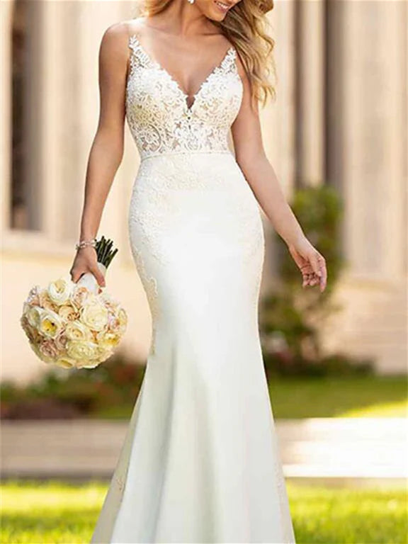 Side profile of the mermaid wedding dress, emphasizing the graceful silhouette and the sweep of the court train.