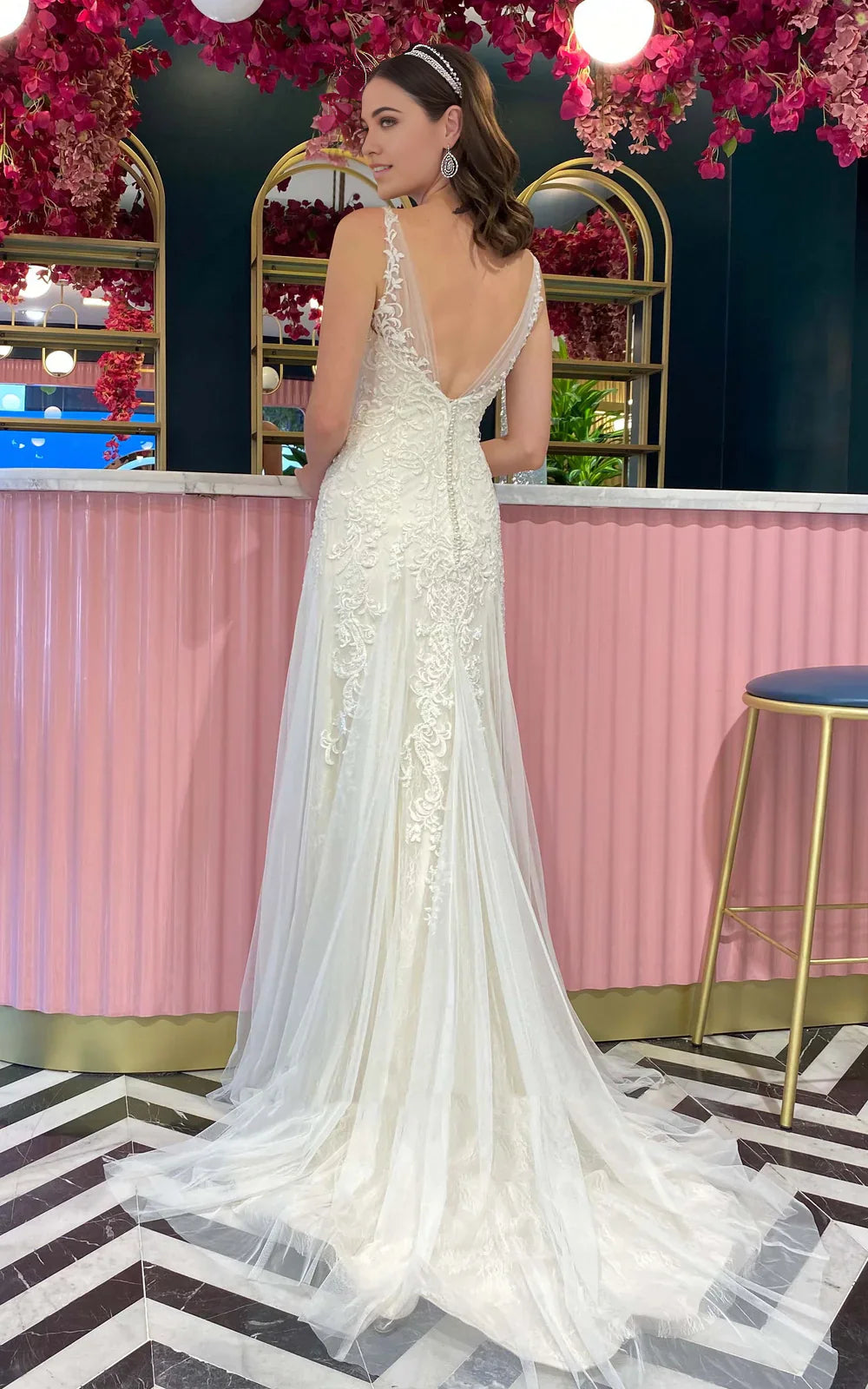 Back view of mermaid wedding dress showing pleated tulle and train.