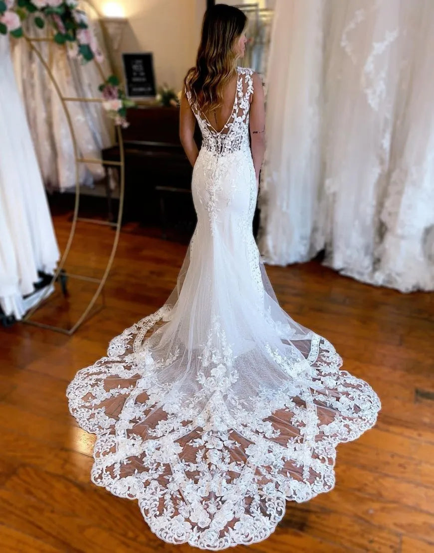 Back view of Mermaid wedding dress, highlighting appliques and chapel train.