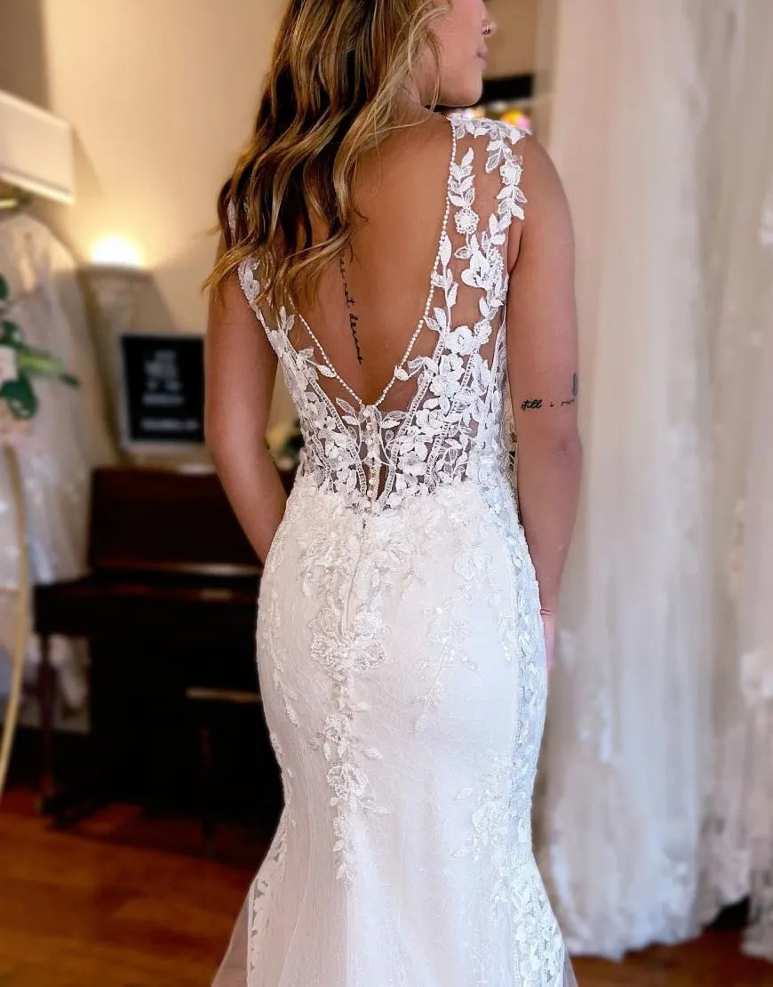 Side view of V-Neck Mermaid wedding gown, showcasing intricate appliques.