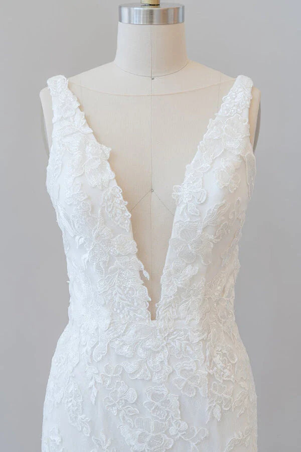 Close-up of appliques and lace on a mermaid wedding dress.