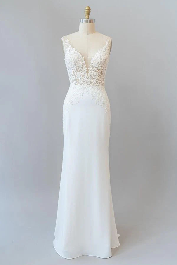 Elegant mermaid wedding dress with V-neck and lace details.