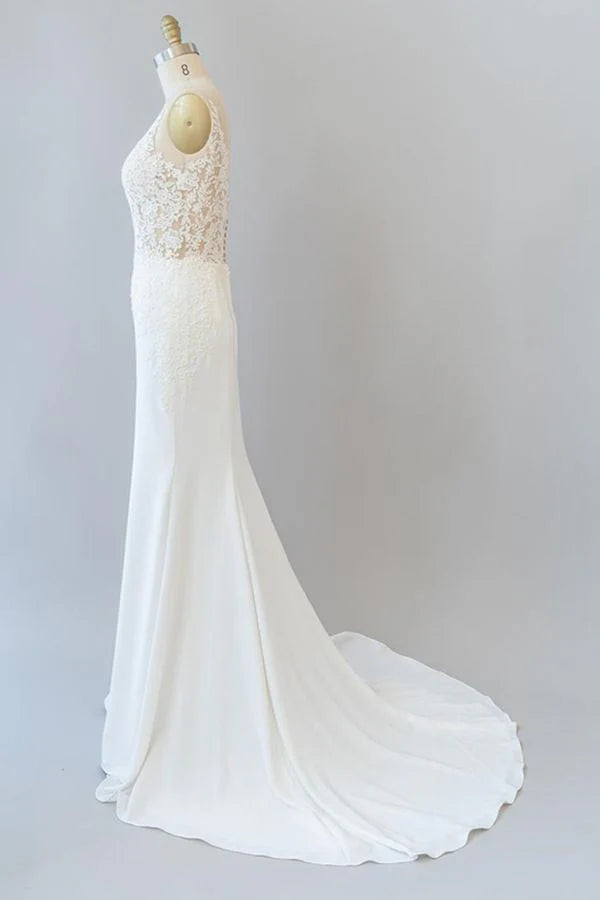Close-up of the intricate lace on the backless wedding dress.