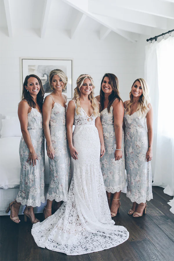 Side profile of a mermaid V-neck lace wedding dress, highlighting the lace details.