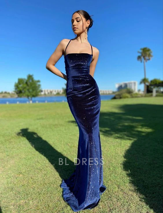 Navy blue mermaid velvet dress with spaghetti straps, front view.