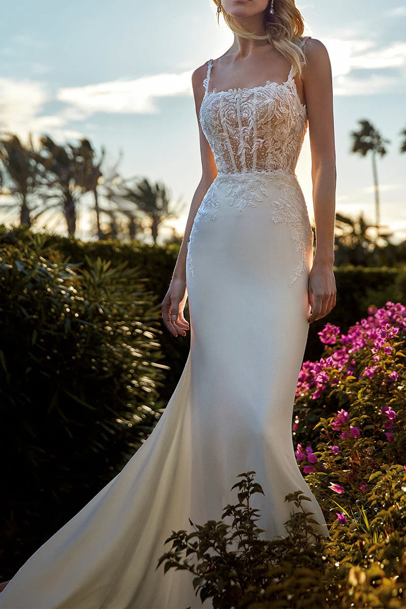 Mermaid wedding dress with a scoop neck and lace appliques, showing the full silhouette.