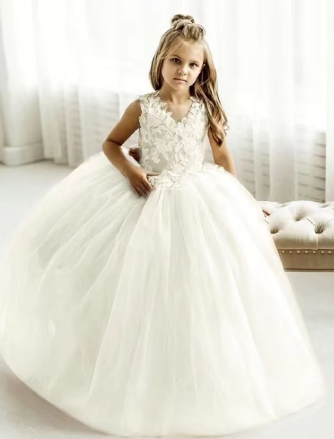 Back view of the sleeveless white princess party dress.