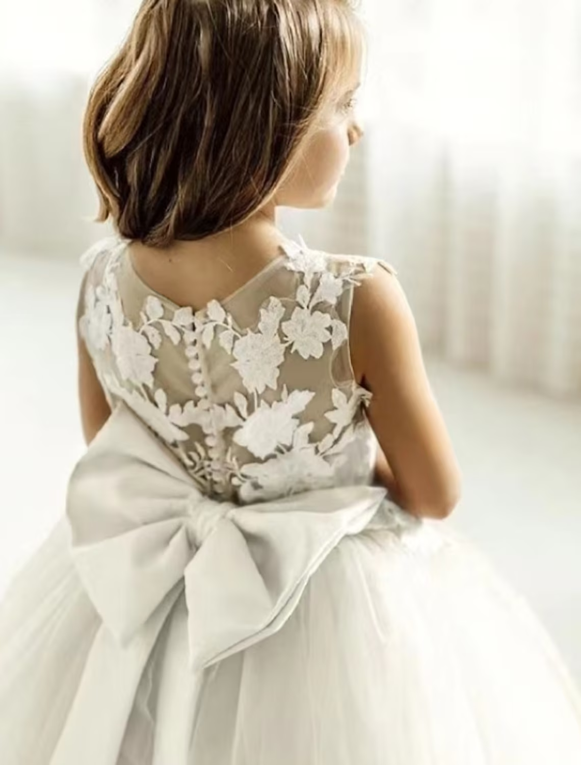 Full view of the white princess party dress with a sweet design.