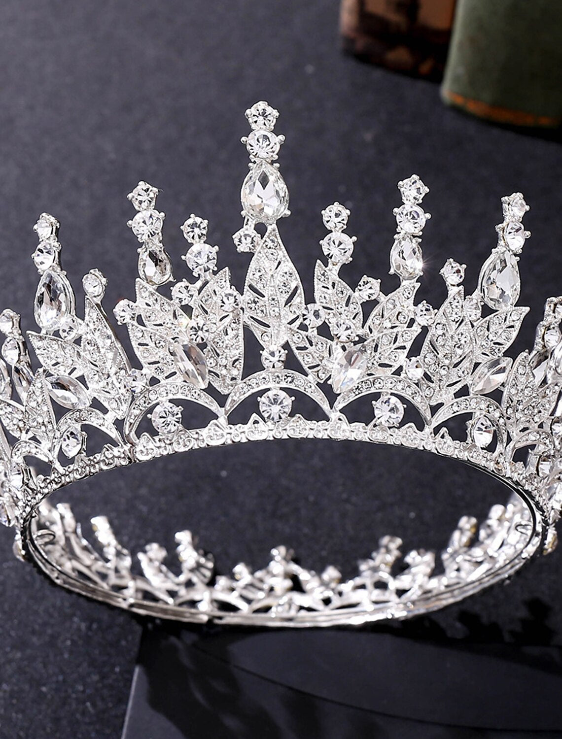Close-up of a metal crown tiara, showcasing intricate design.