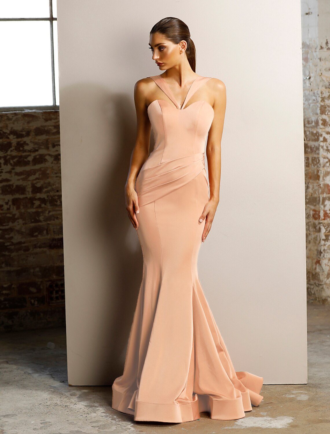 Full-length view of the elegant mermaid trumpet evening gown.