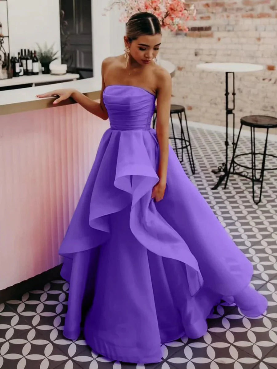 Graceful silhouette of the strapless floor-length gown.