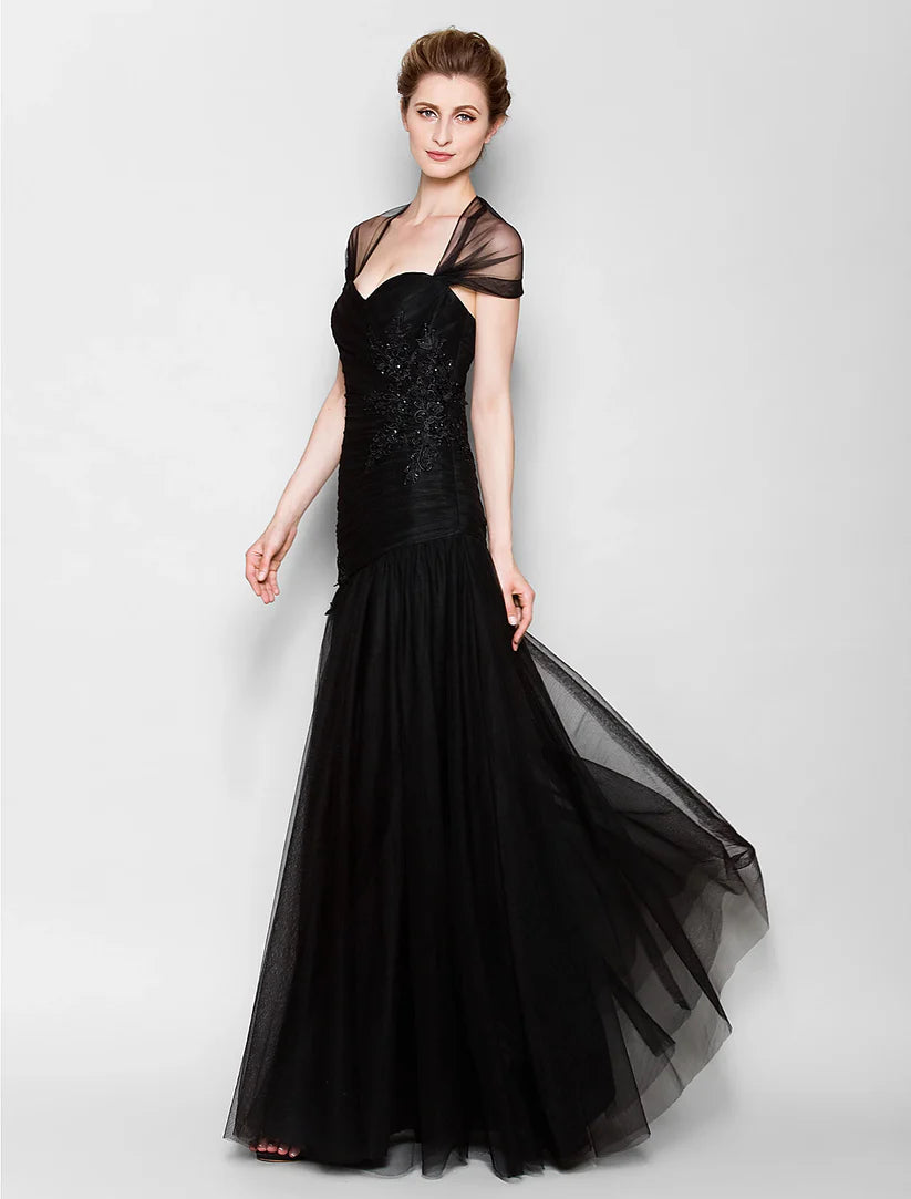 Side profile of an elegant Mother of the Bride dress with short sleeves.
