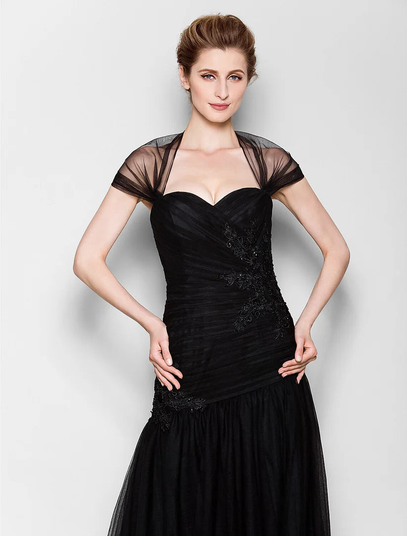 Full view of a woman wearing a Queen Anne neckline Mother of the Bride dress.