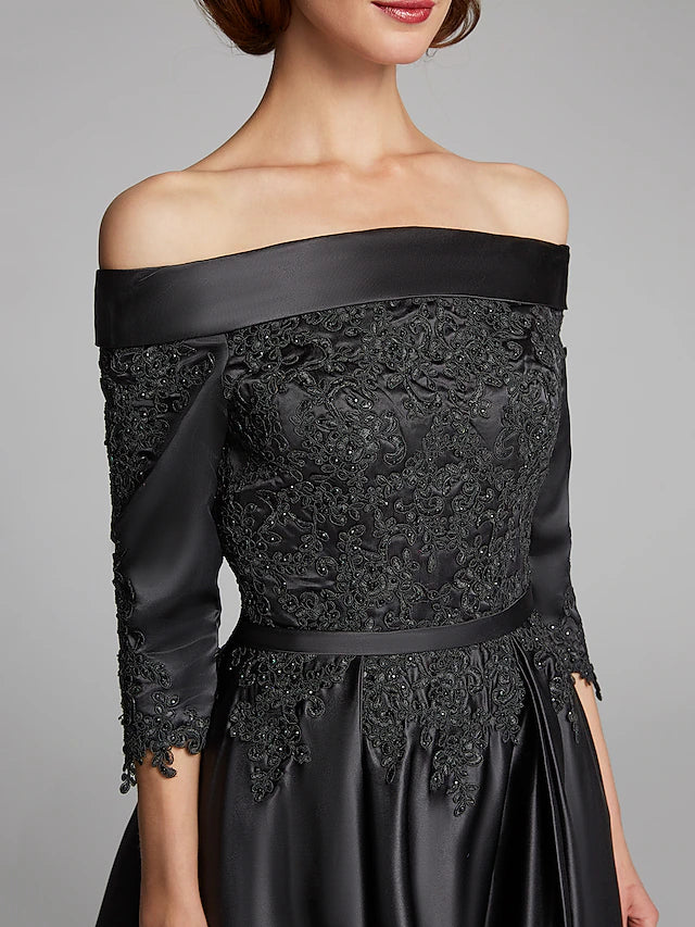 Side view of the elegant navy A-line off-shoulder dress, showcasing the tea length.