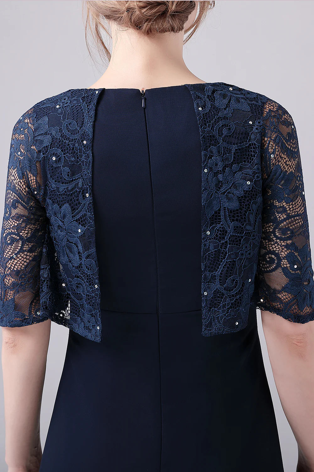 Full length view of the elegant navy Mother of the Bride gown.