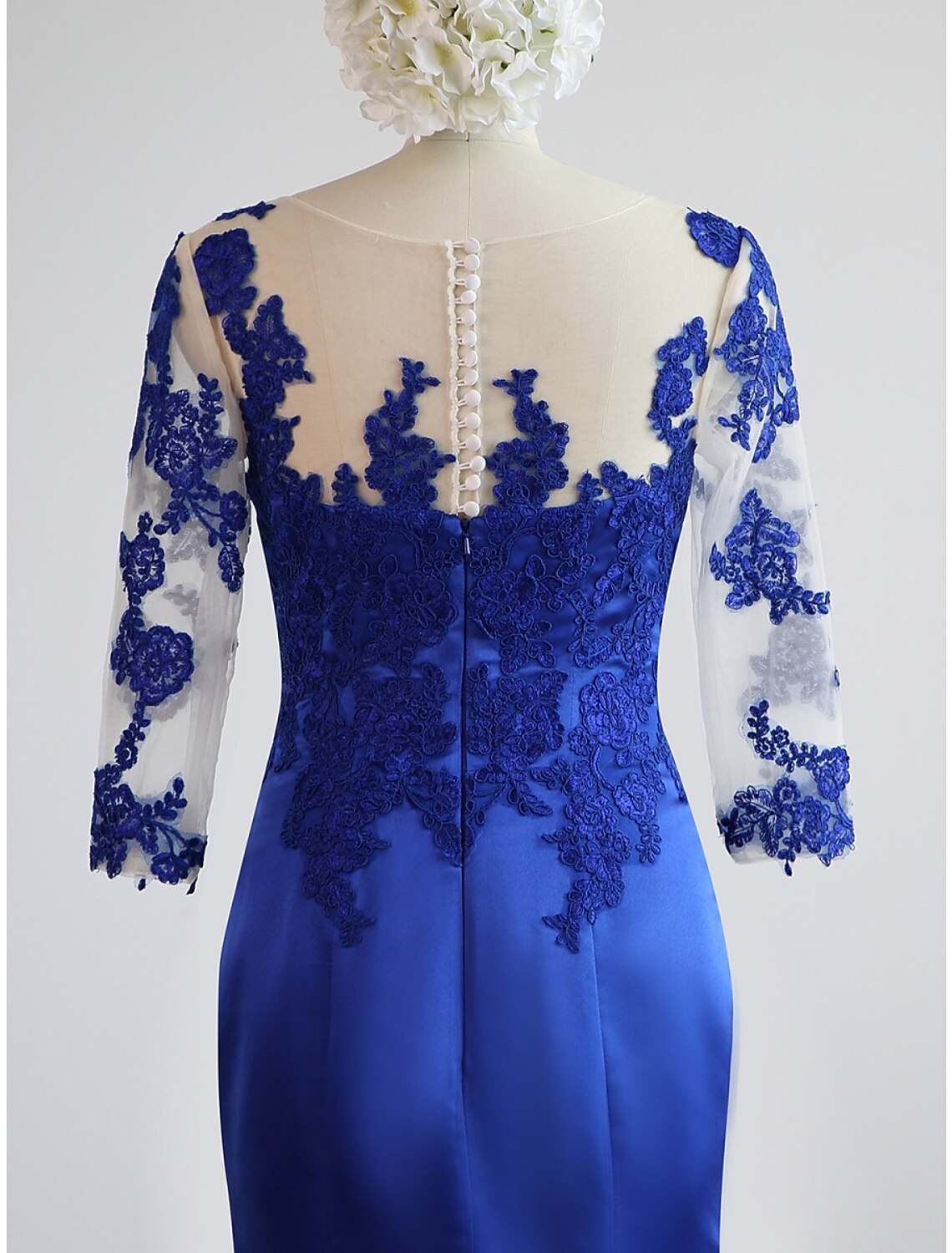 Back view of the navy blue mermaid trumpet dress, showcasing the floor-length design.