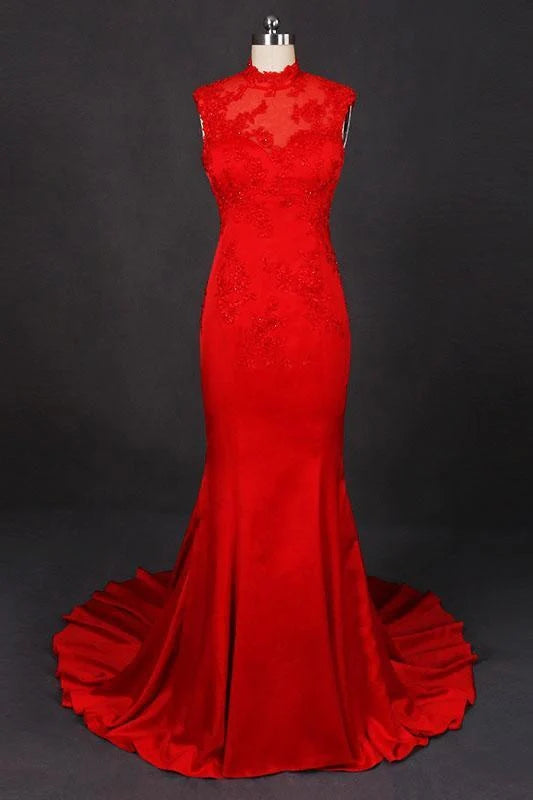 Woman in elegant navy high neck satin evening dress with appliques.