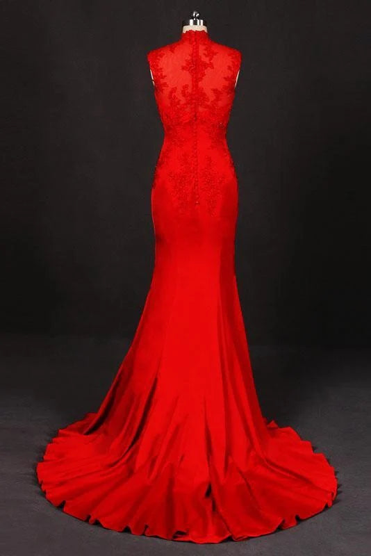 Back view of navy high neck satin prom dress with intricate appliques.
