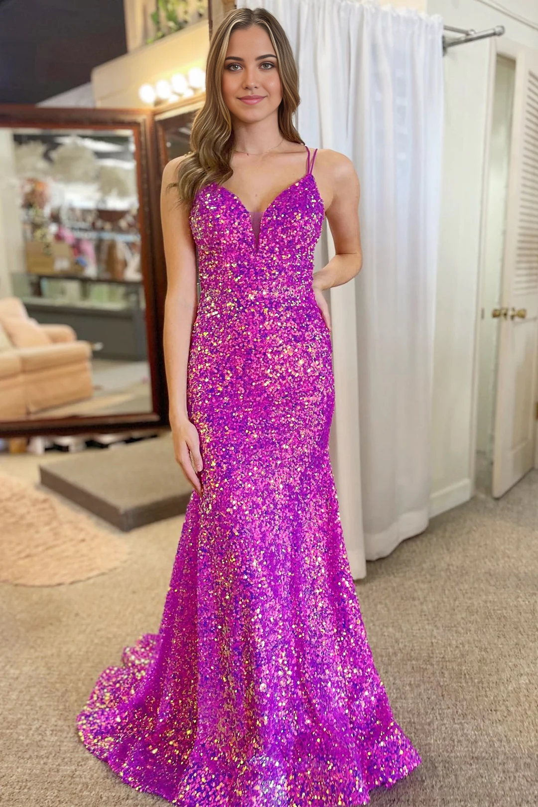 Elegant navy mermaid sequin gown with V-neckline.