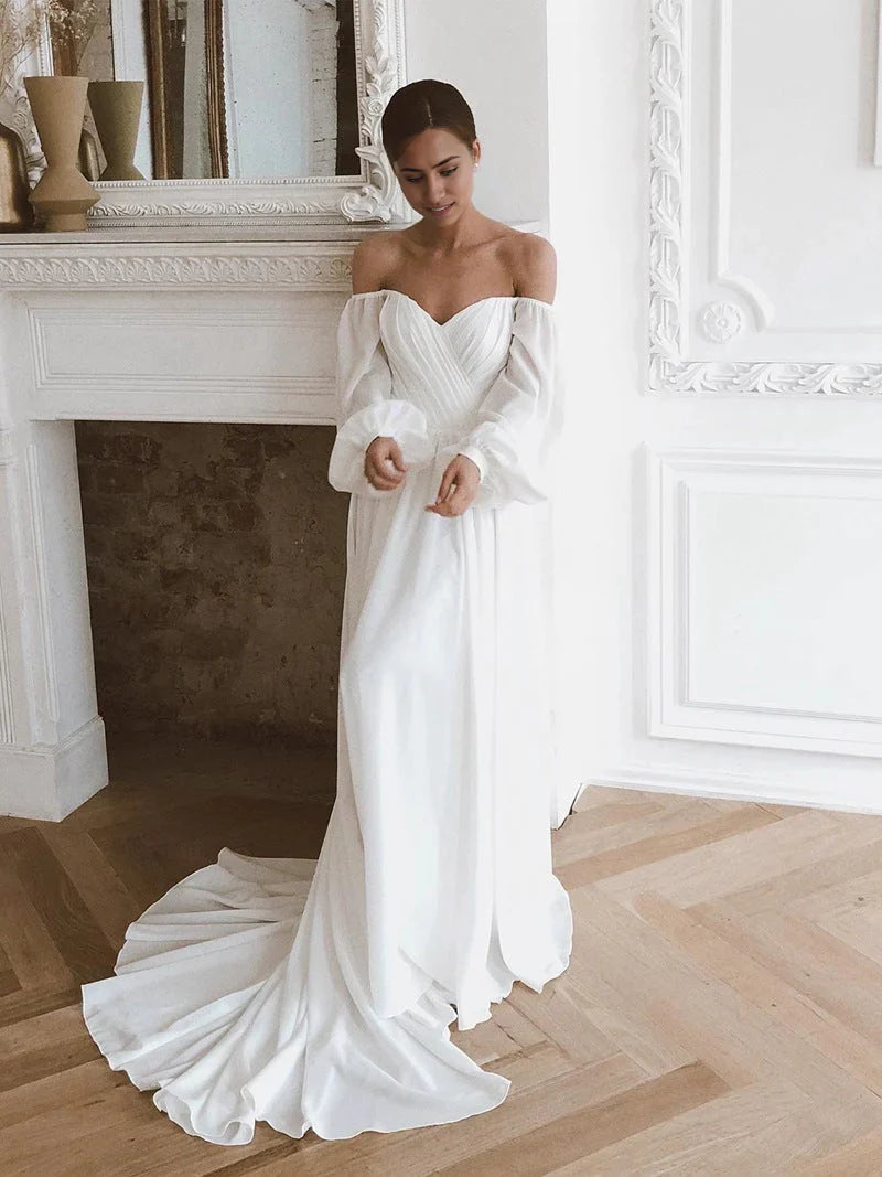 Elegant off-shoulder chiffon long-sleeve A-line wedding dress.