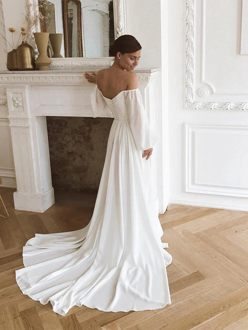 Model showcasing the off-shoulder long-sleeve chiffon wedding dress.