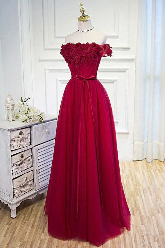Elegant off-the-shoulder floor-length prom dress with a floral belt.
