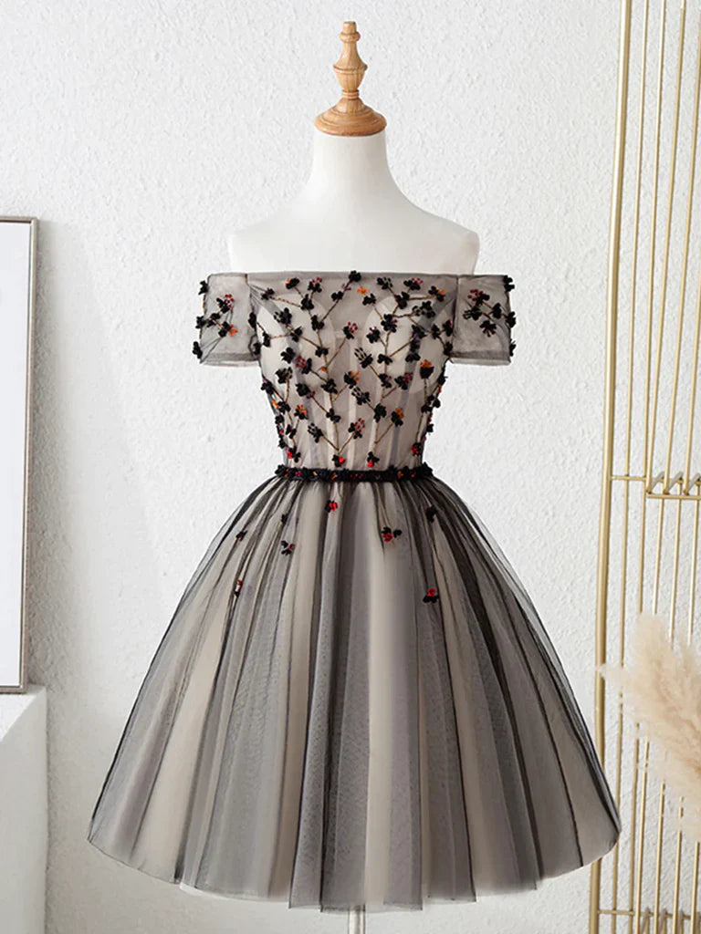 Model wearing an elegant off-shoulder short floral tulle prom dress.
