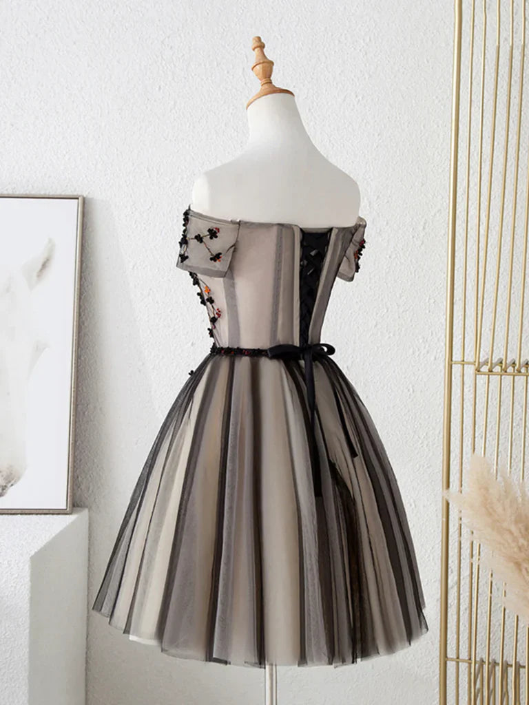Close-up of the floral details and tulle fabric on the prom dress.
