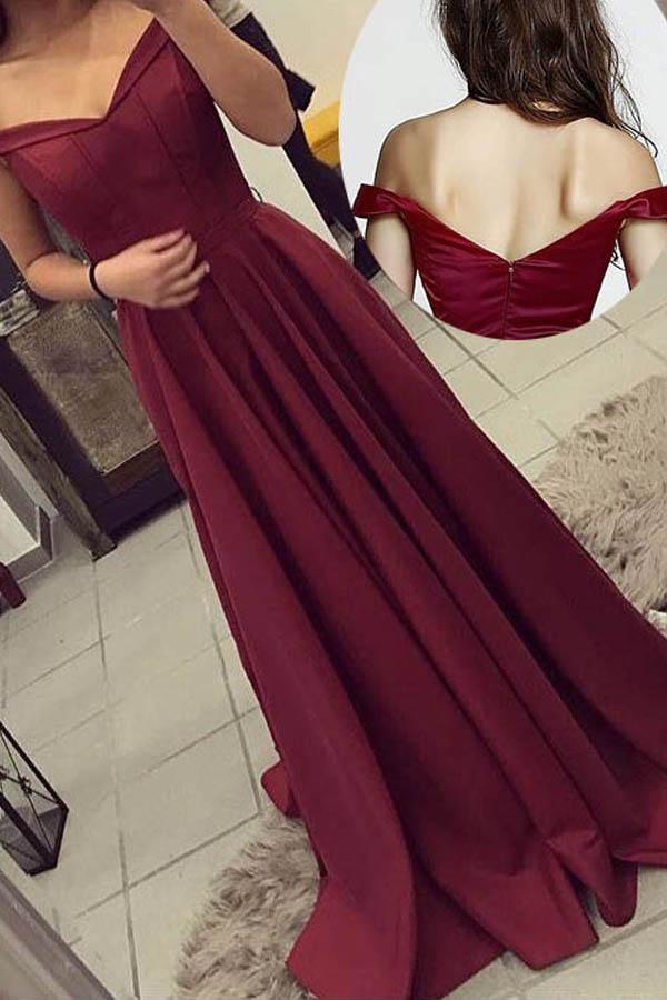 Elegant off-the-shoulder long prom gown with a flowing skirt.
