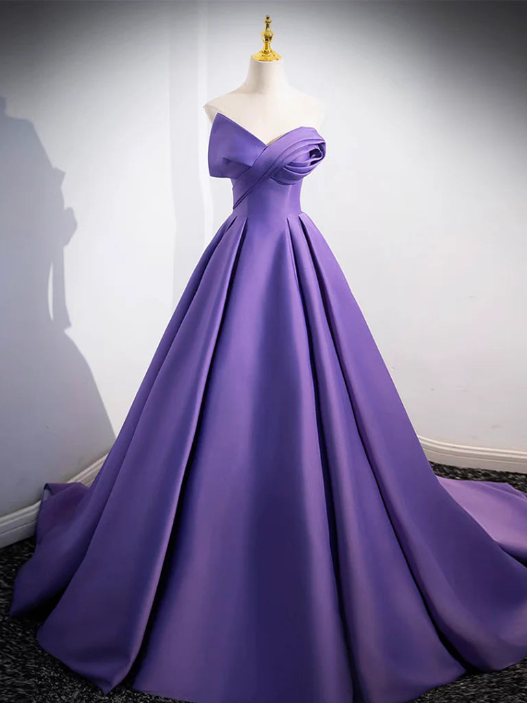 Close-up of the satin fabric and off-shoulder detail of the long prom dress.