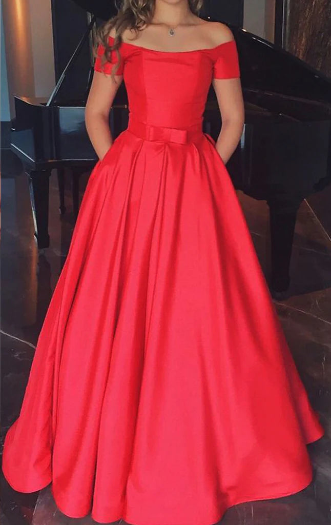 Woman wearing an elegant off-shoulder long satin prom dress.