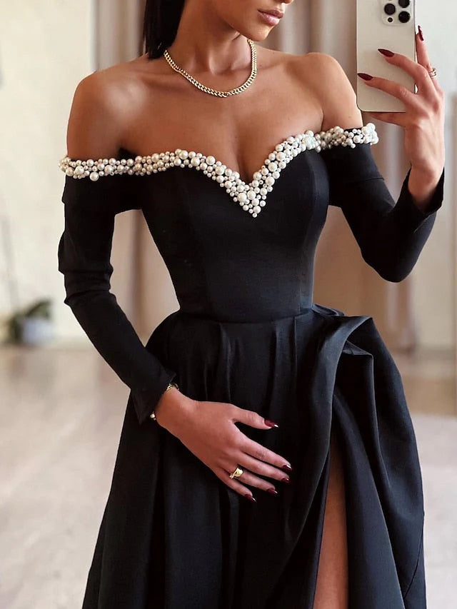 Model showcasing an off-shoulder long formal dress.