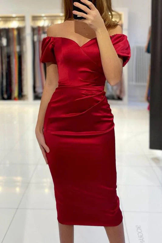 Woman wearing a short off-shoulder burgundy prom dress.