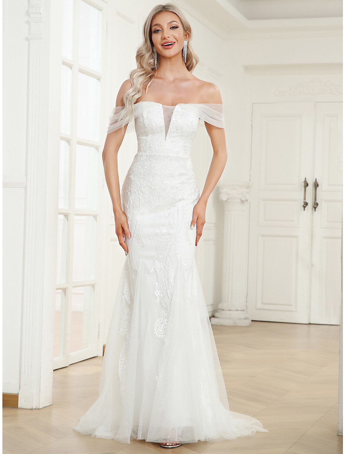 Elegant off-shoulder cap sleeve lace mermaid trumpet wedding dress.