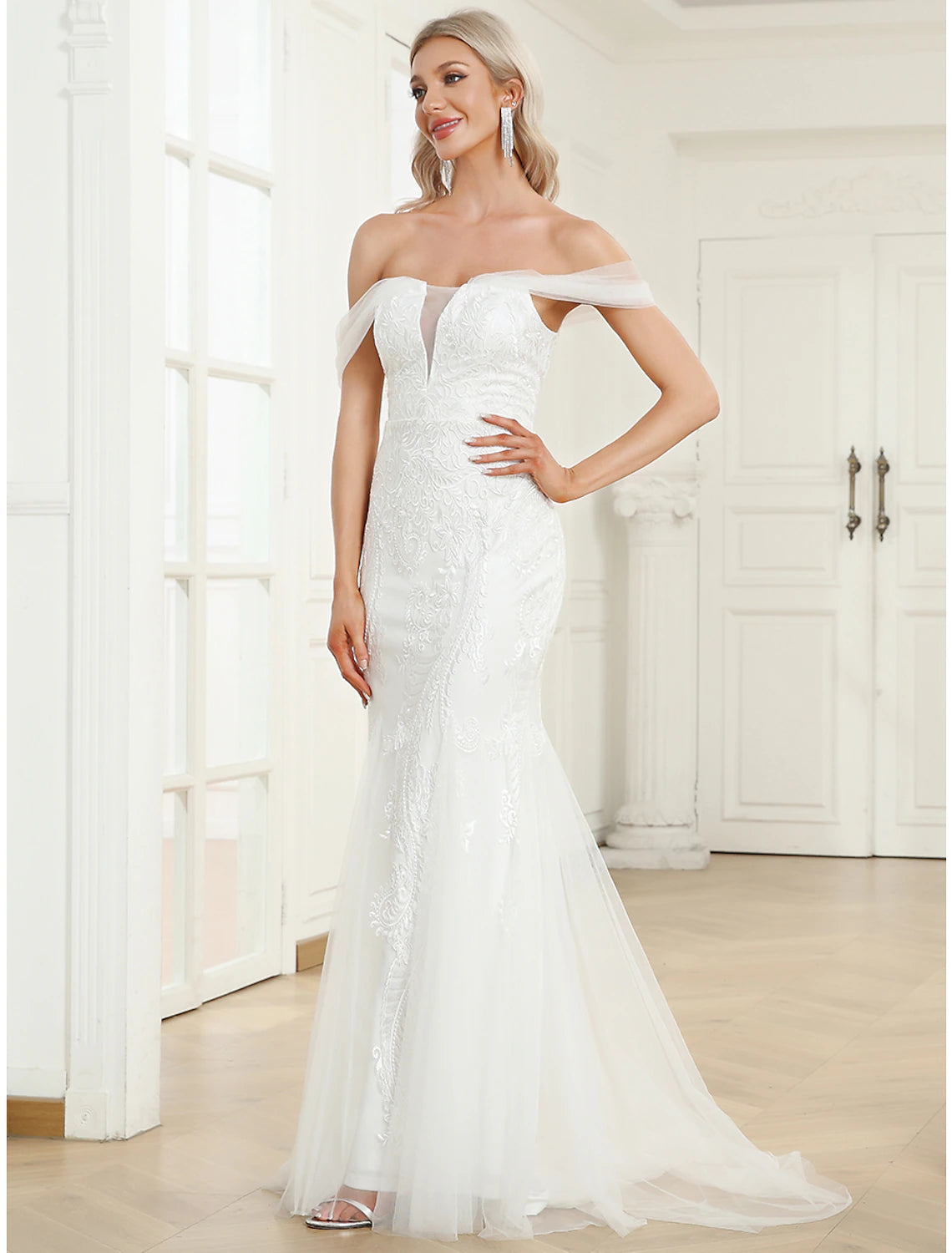 Back view of the lace applique mermaid trumpet wedding dress.