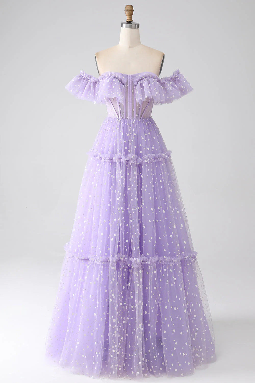 Woman posing in an elegant lilac off-shoulder corset maxi prom dress.