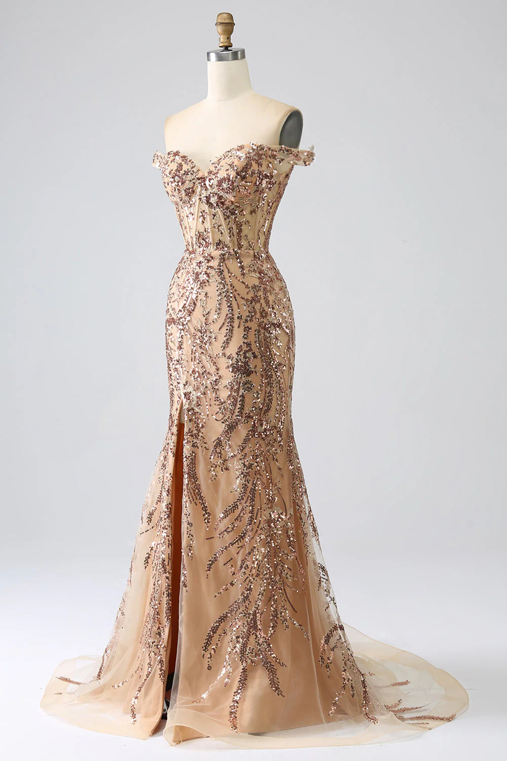 Side view of champagne off-shoulder gown highlighting the leg slit.