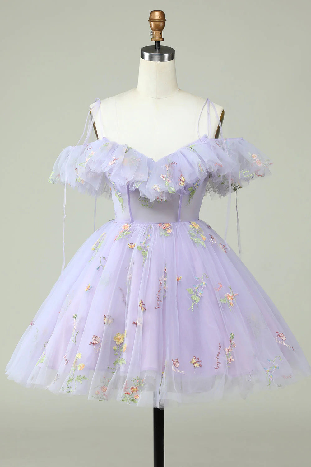 Front view of a woman wearing a lavender off-shoulder corset ruffled short prom dress.
