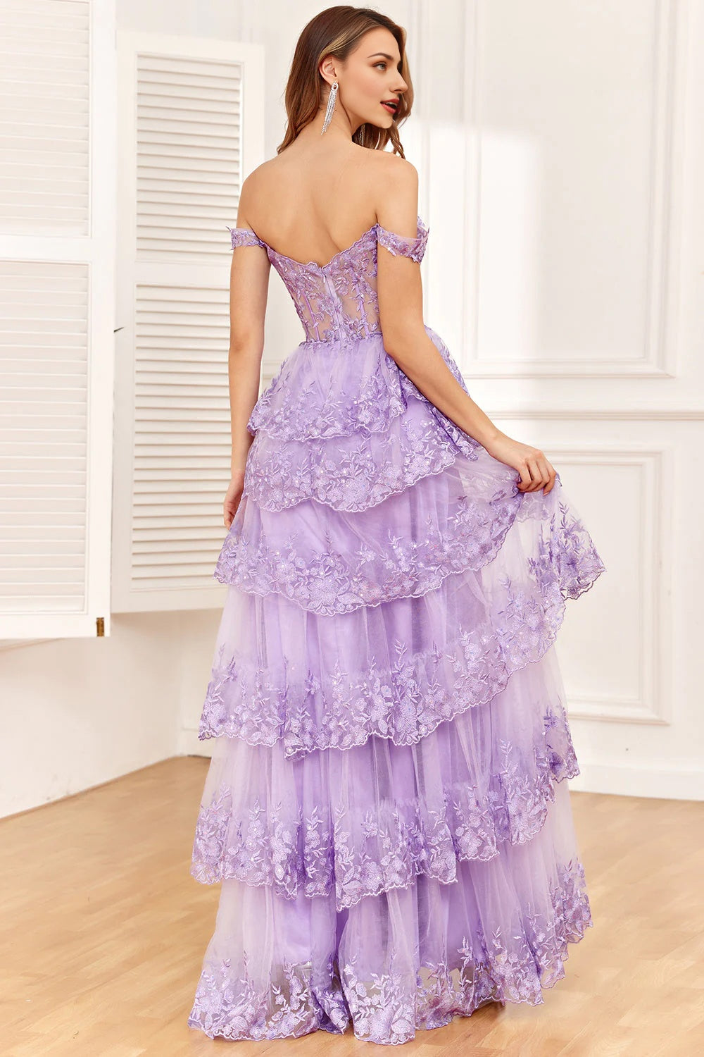 Back view of the purple off-shoulder corset formal dress.