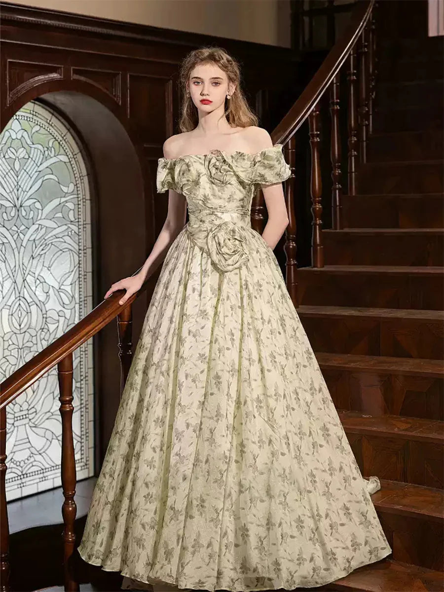 Sage off-shoulder ball gown with floral brocade and 3D rose details.