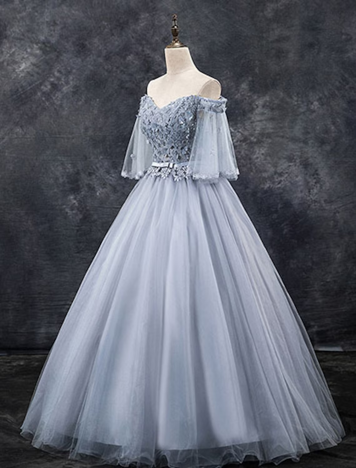 Full view of an elegant off-shoulder floral tulle ball gown Quinceanera dress.