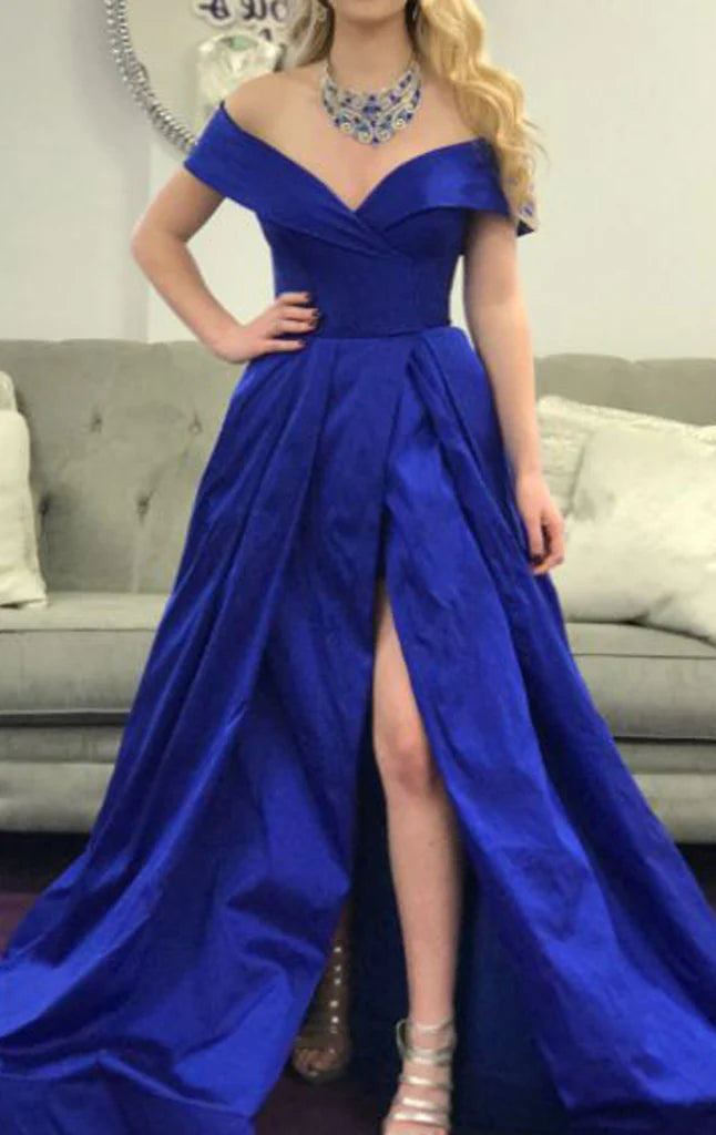 Elegant off-shoulder long prom dress in a vibrant color.