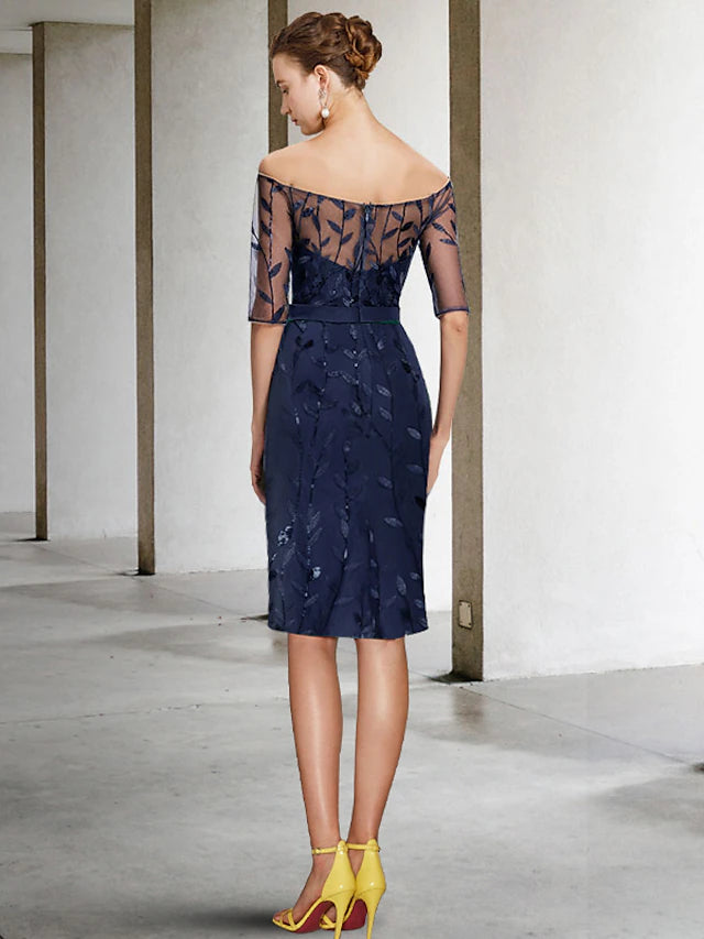 Back view of the two-piece sheath off-shoulder sequined formal dress.