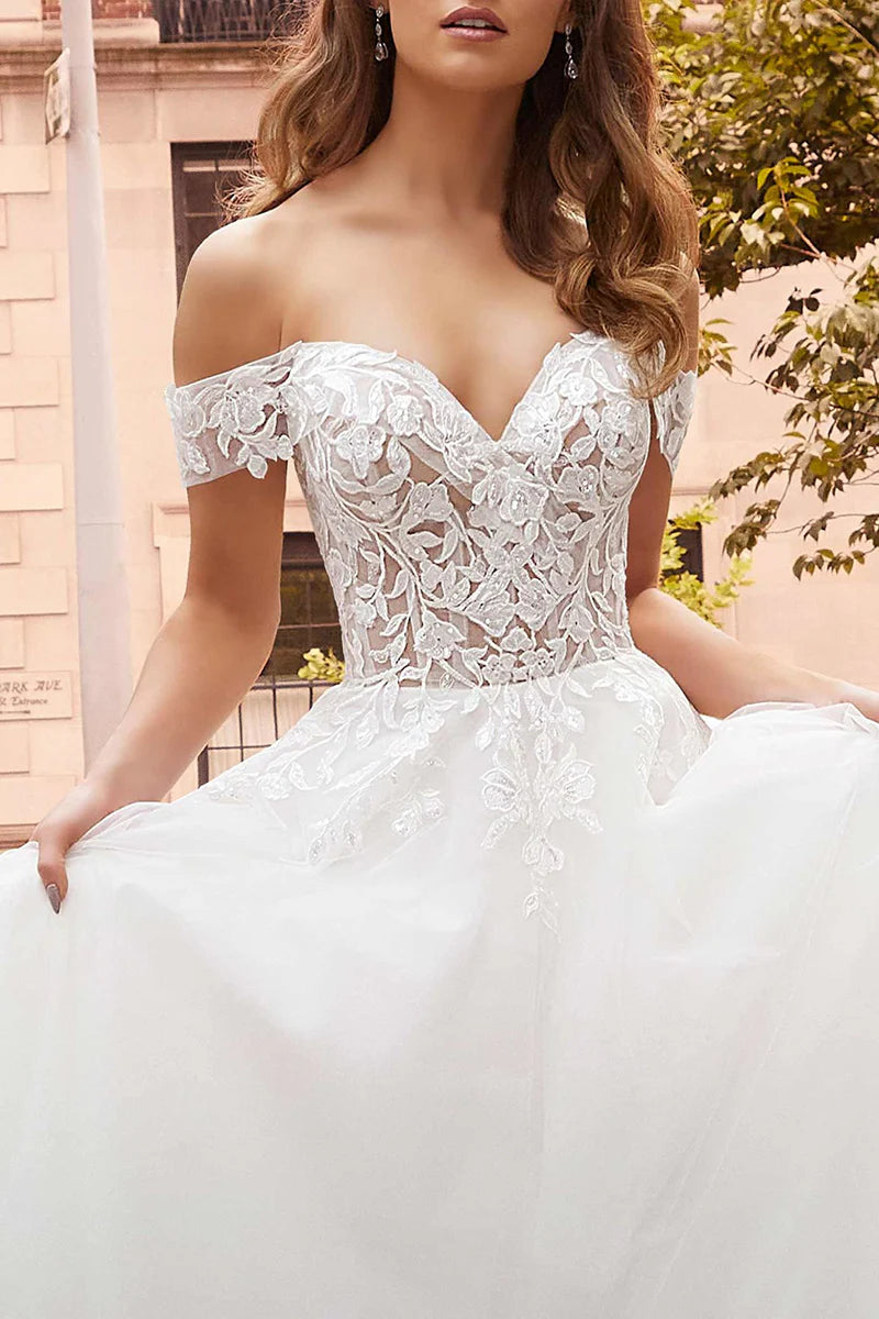 Close-up of lace appliques on the wedding dress.