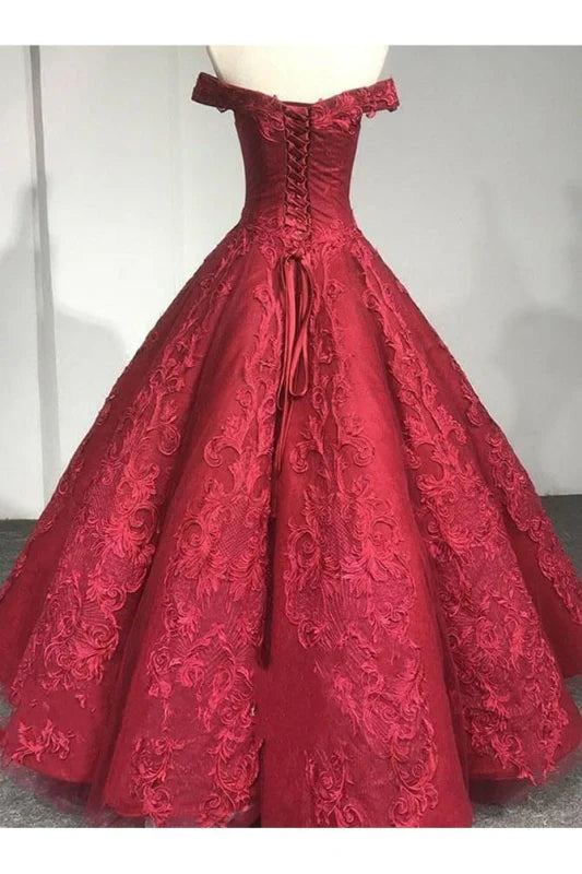 Off-shoulder lace formal gown with intricate detailing.